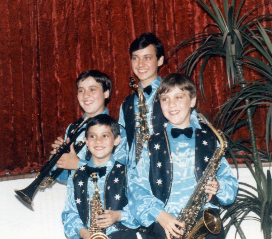 The four young Rossello brothers in matching star-spangled stage costumes